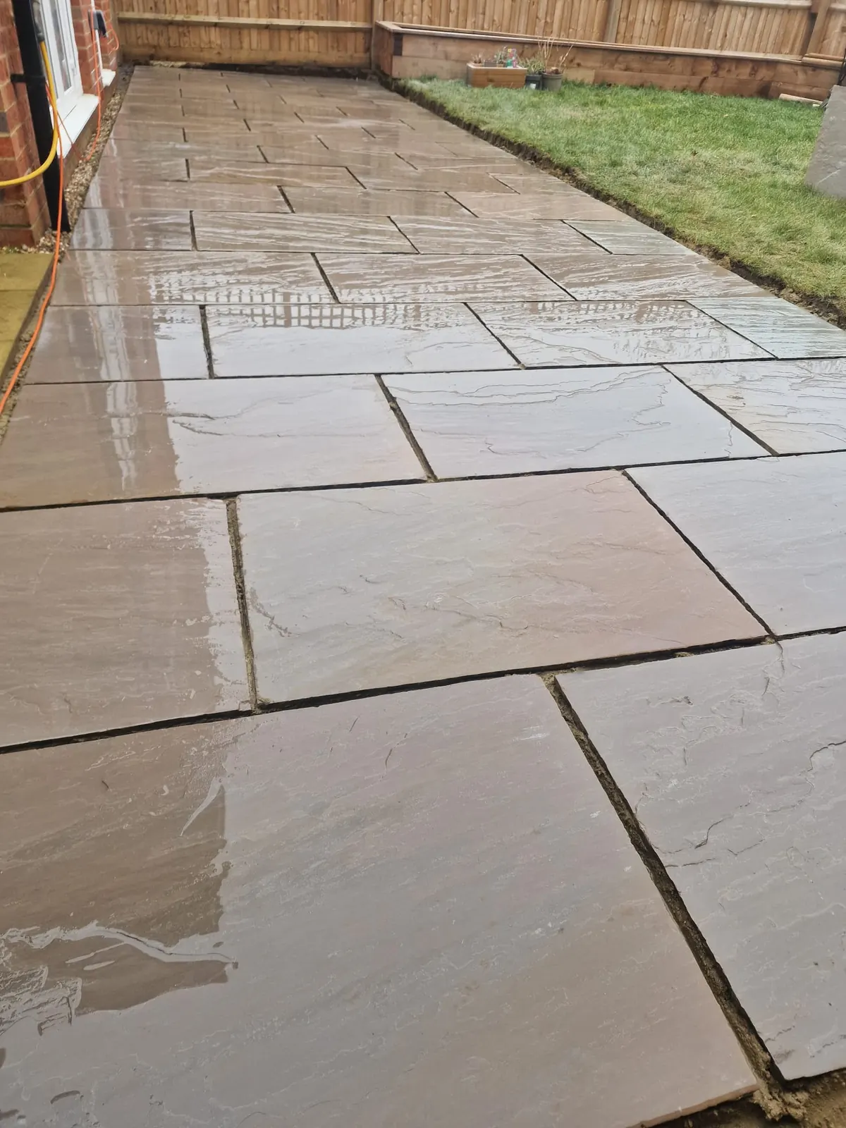 Wet riven sandstone patio - Berkshire