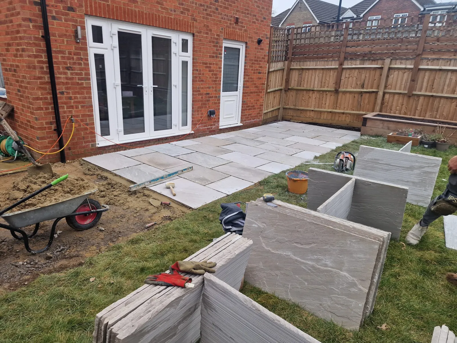 Green Team landscapers laying paving in Reading